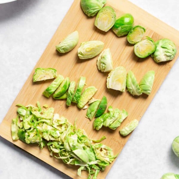 top view of brussel sprouts cut 4 ways on a cutting board