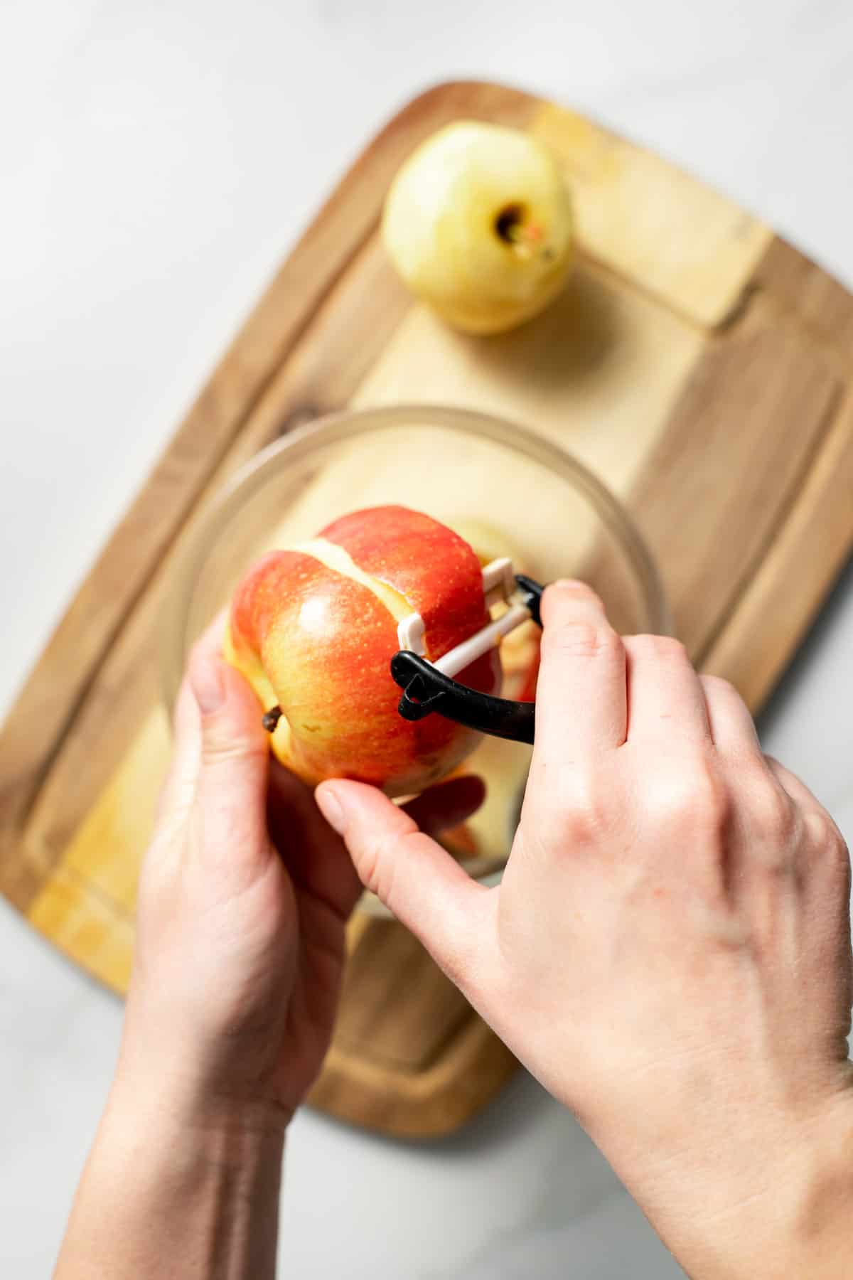 peeling an apple with peeler