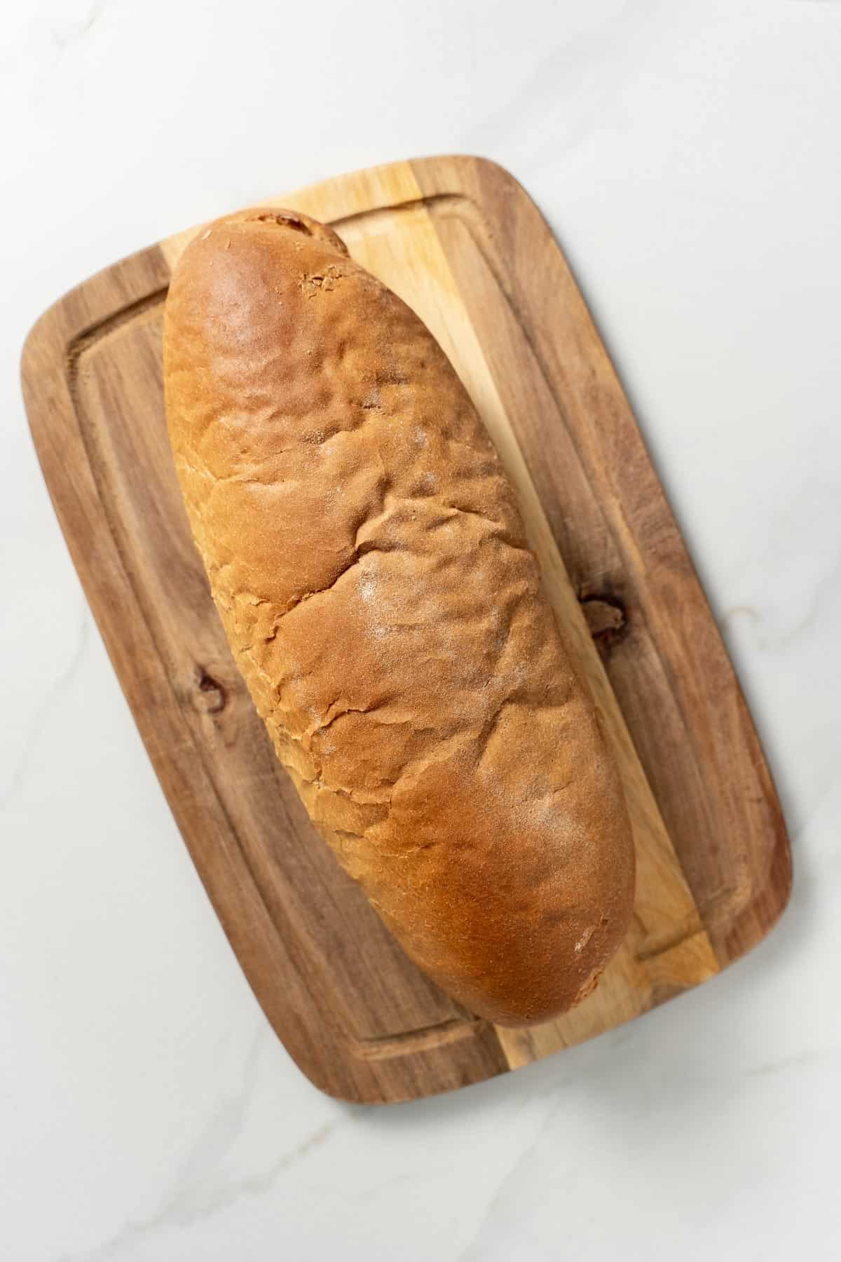 one loaf of bread on cutting board