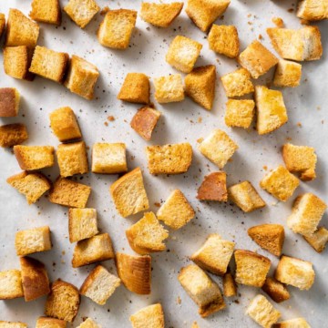 top view of croutons on baking sheet with parchment paper