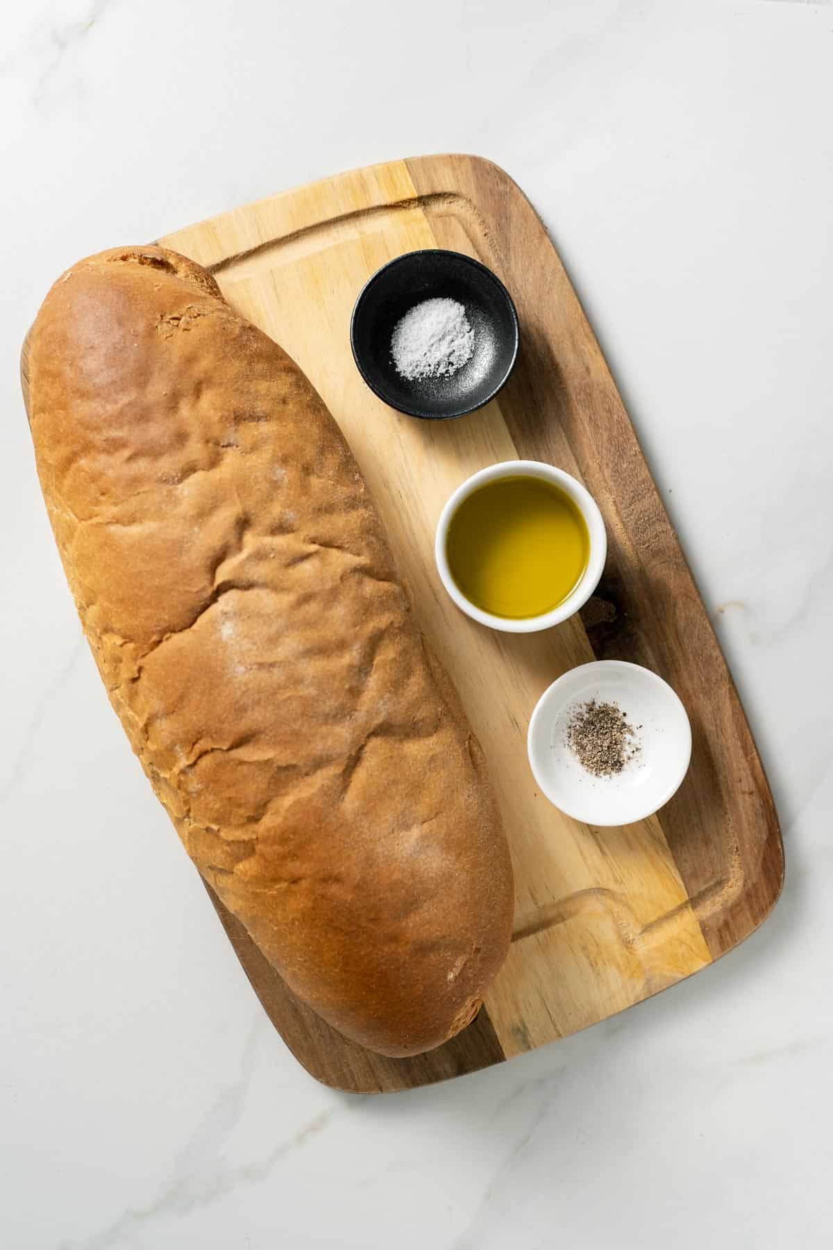 one loaf of bread with olive oil, sea salt, black pepper 