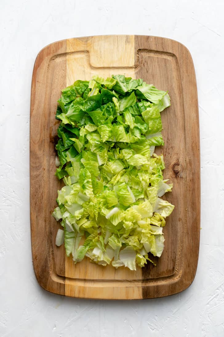 chopped romaine lettuce on cutting board