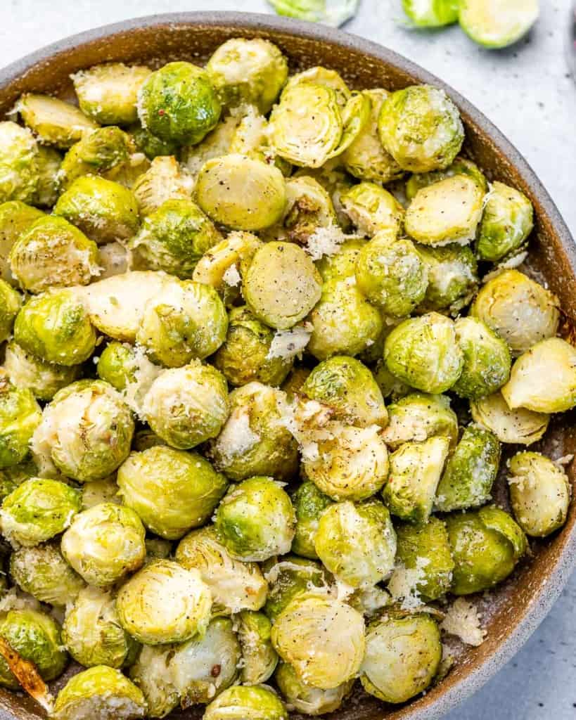 Roasted Brussels sprouts topped with garlic and parmesan cheese.