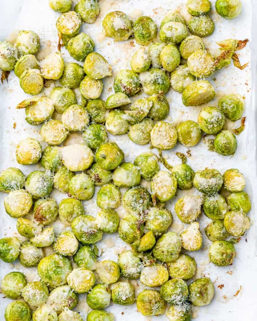 Roasted Brussels sprouts on a sheet pan.