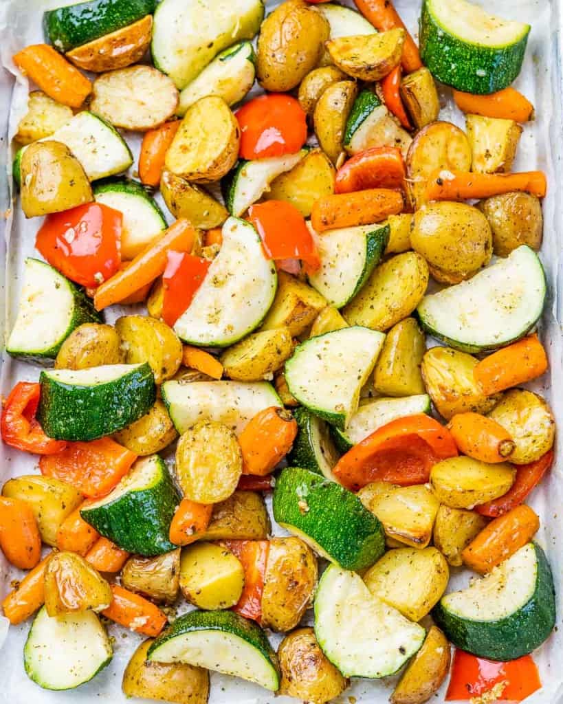 Garlic roasted vegetables on a sheet pan.