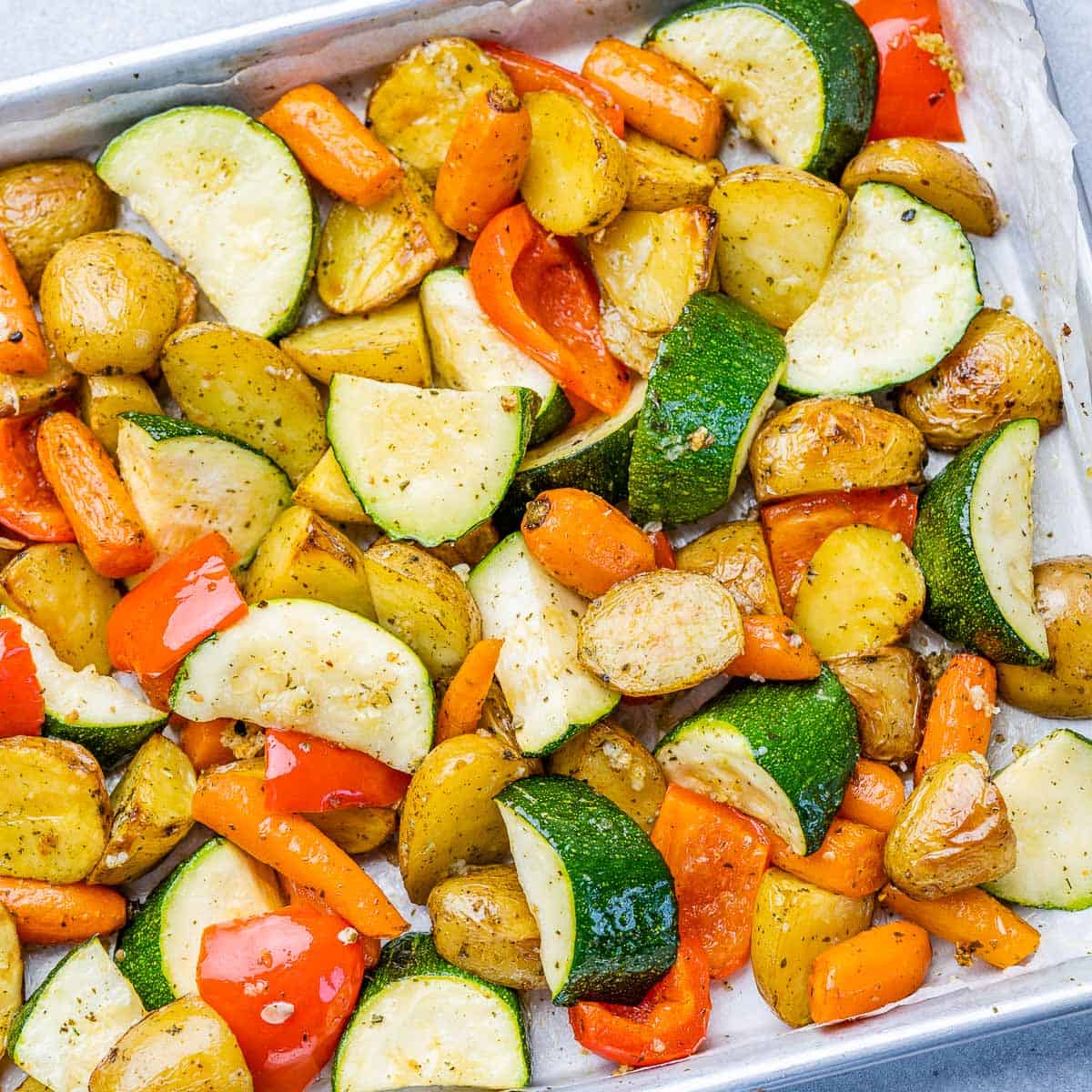 top view of roasted veggies on a baking sheet pan