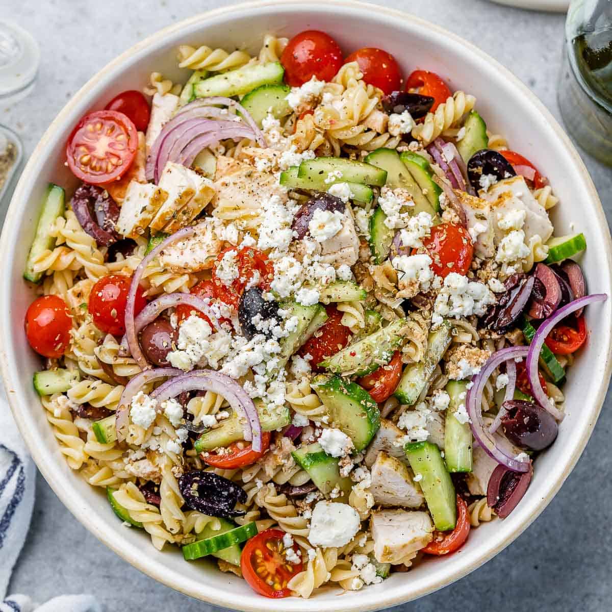 top view pasta salad in a white bowl