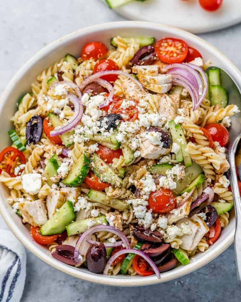 Past salad with chicken, tomatoes, cucumbers, red onion and feta cheese.
