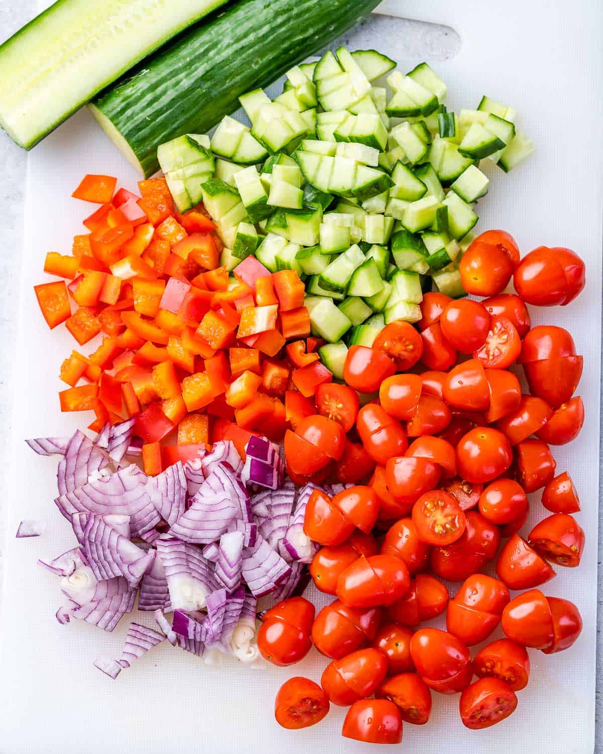 Chopped tomato, bell pepper, red onion and cucumber.