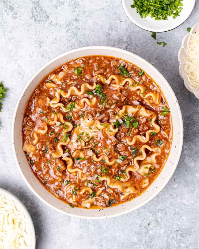 top view lasagna soup in a white round bowl