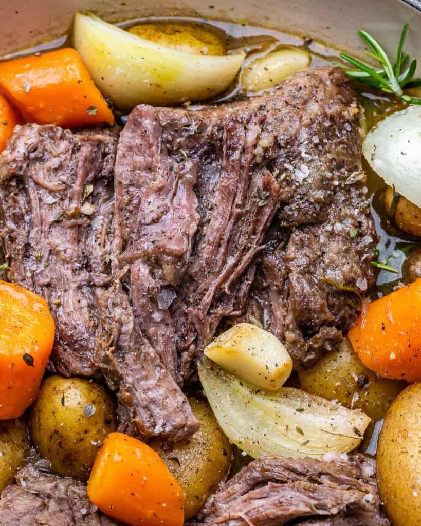 Pot roast with onions, carrots and potatoes.