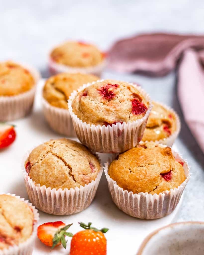 Stacked strawberry muffins.