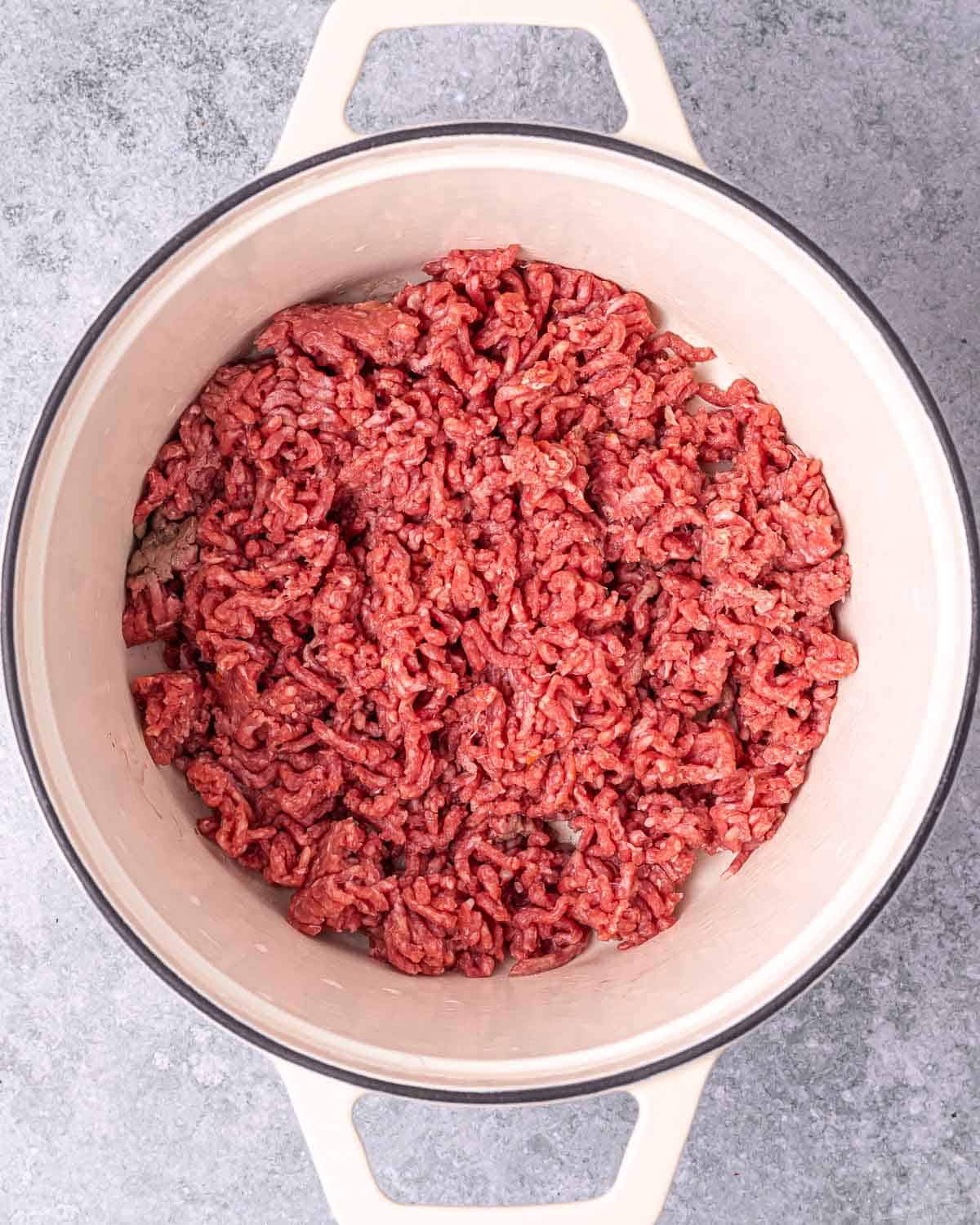 Browning ground beef in a large pot.