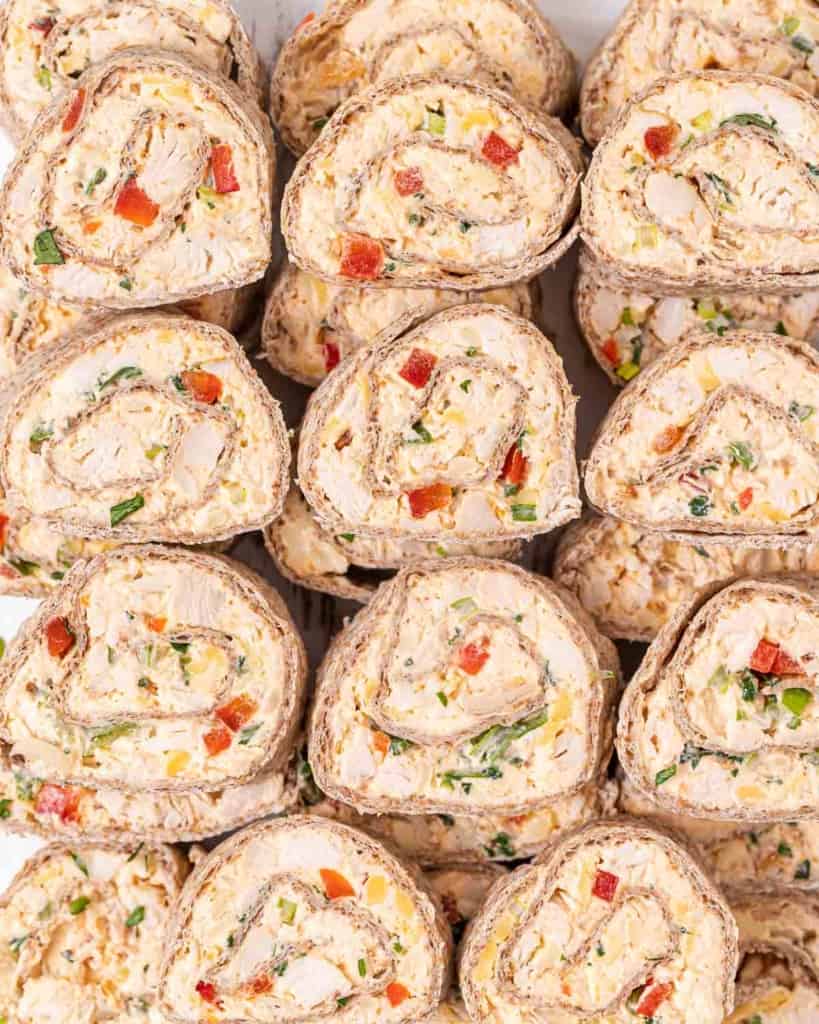 Tortillas rolled into pinwheels with cream cheese, chicken and veggies.