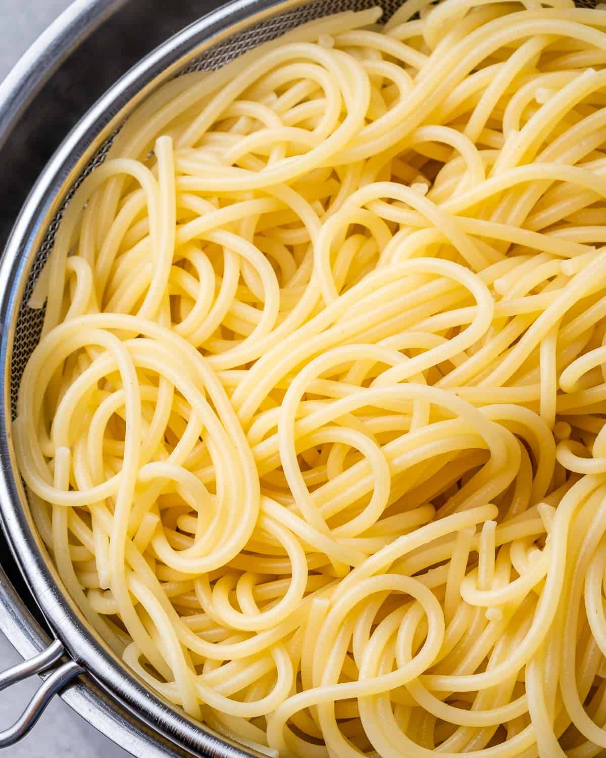 spaghetti in a colander to drain