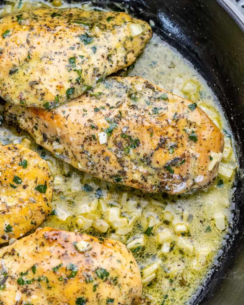 Garlic butter chicken in a large pan.
