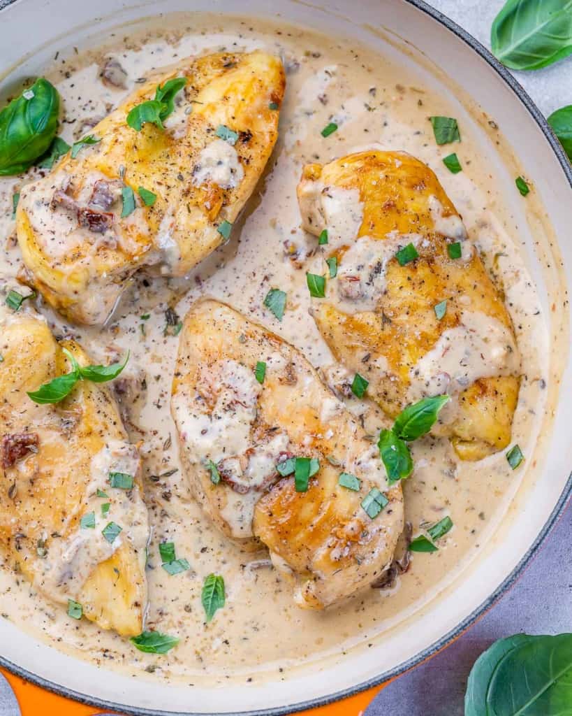 top view of chicken in creamy sauce in a skillet
