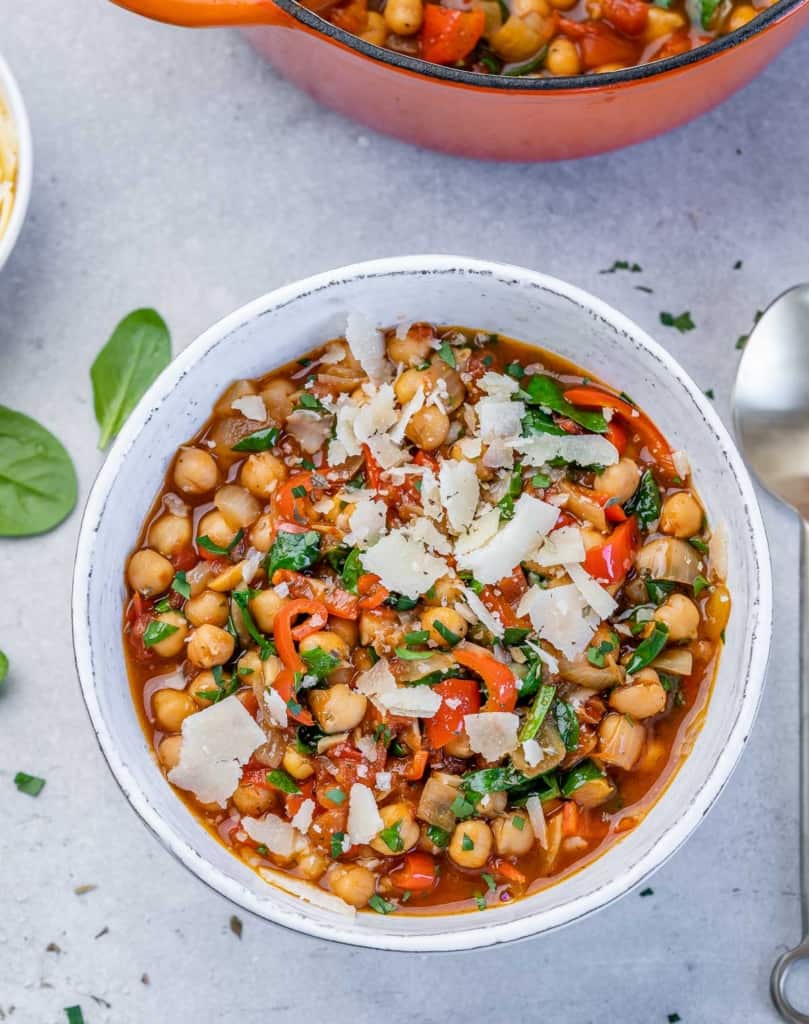 top view white rounf bowl of vegetarian chickpea stew 