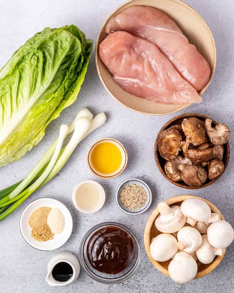 Ingredients for making chicken lettuce wraps divided into small portions.
