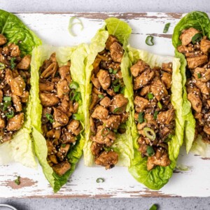 top view of lettuce wraps with chicken on a cutting board