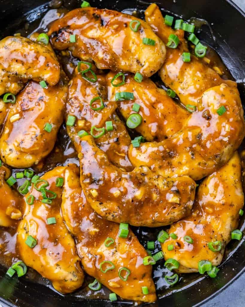 Chicken cooked with a sauce in a pan.