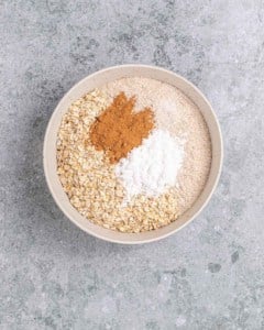 Combining dry ingredients in a large bowl.