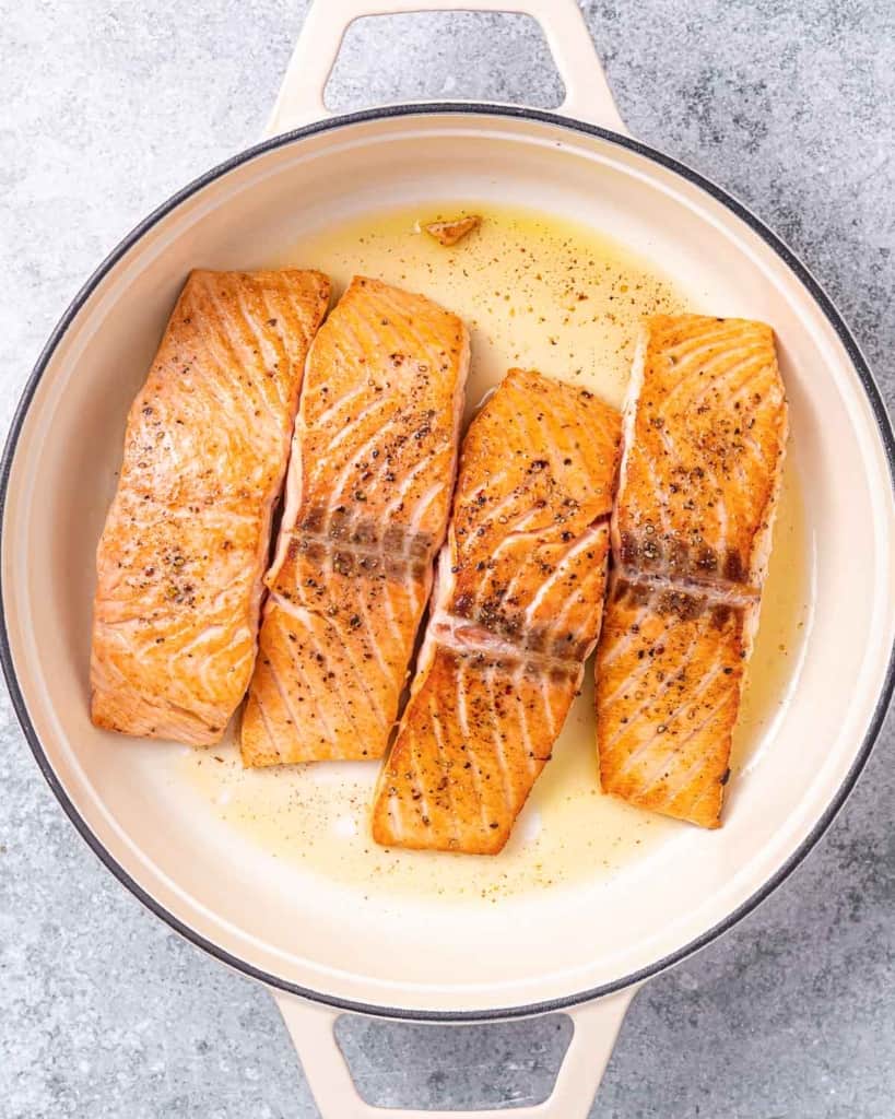 sauteed salmon fillet in a pan