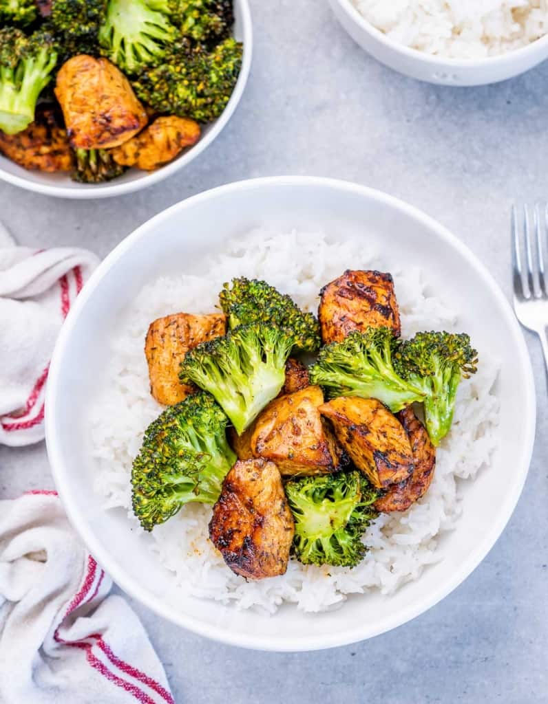 Broccoli and chicken pieces served over rice.