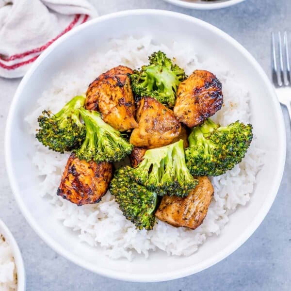 Top view air fried chicken chunks with broccoli and rice.