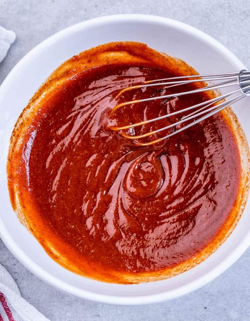 bbq sauce in a bowl with whisk