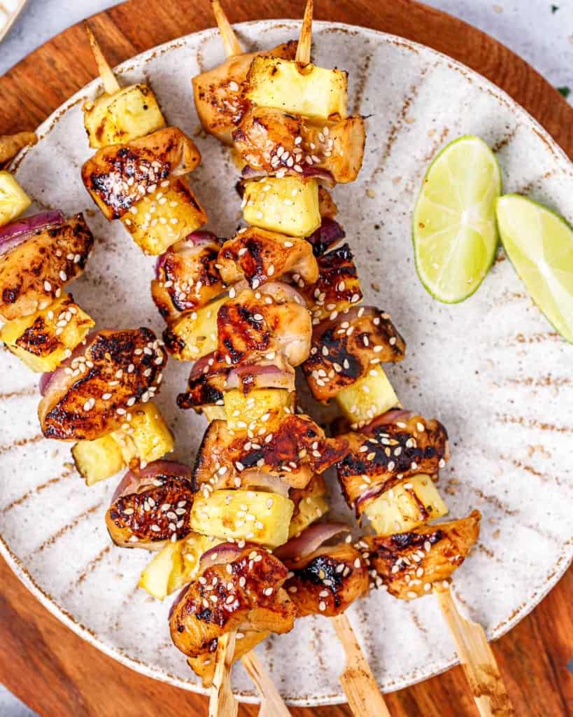 Chicken skewers made with pineapple and red onion.