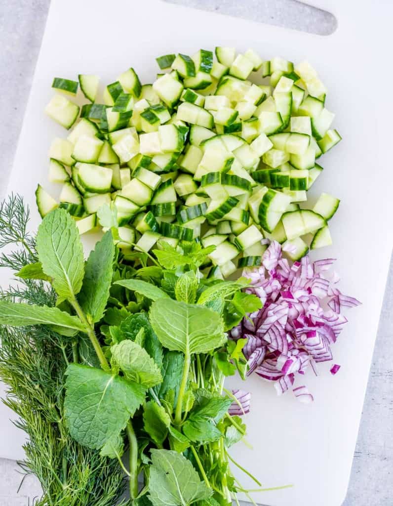 Chopped herbs, cucumber and red onion.