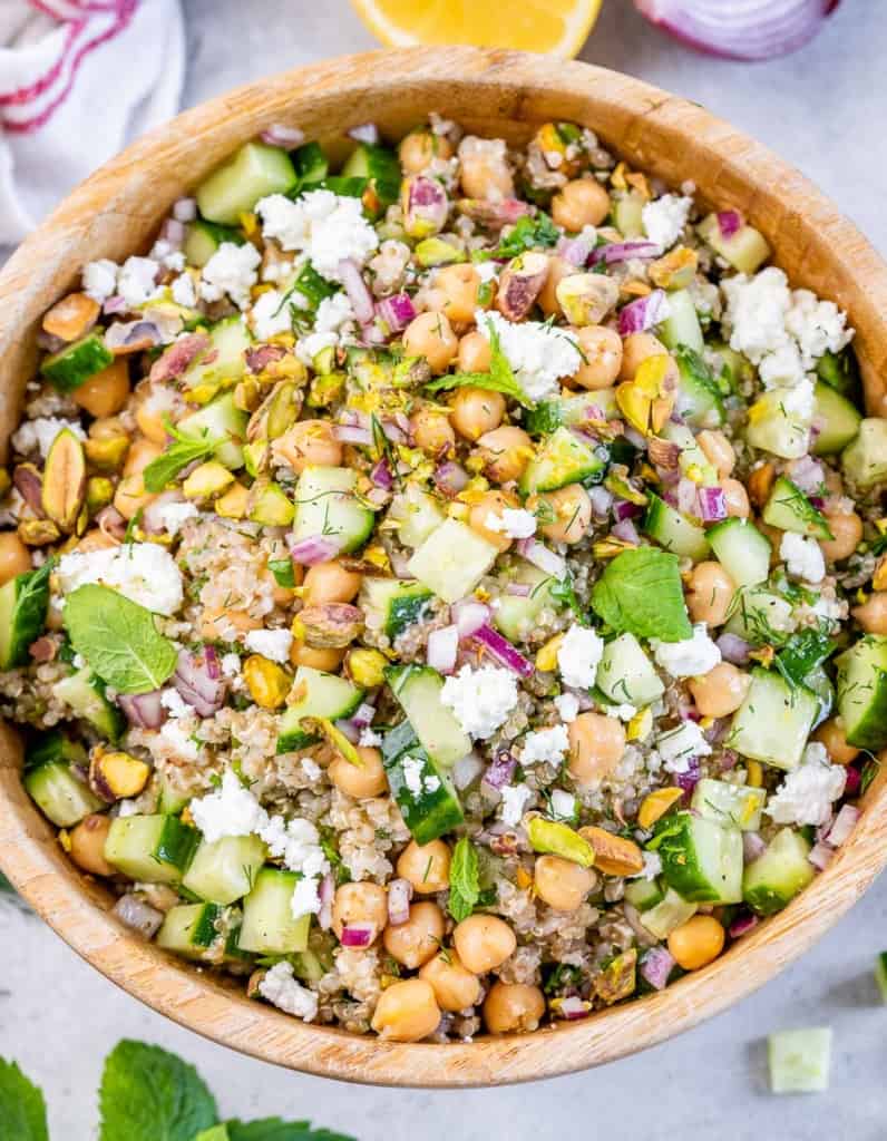 Tossed salad with quinoa, chickpeas, cucumber, red onion, herbs and feta.
