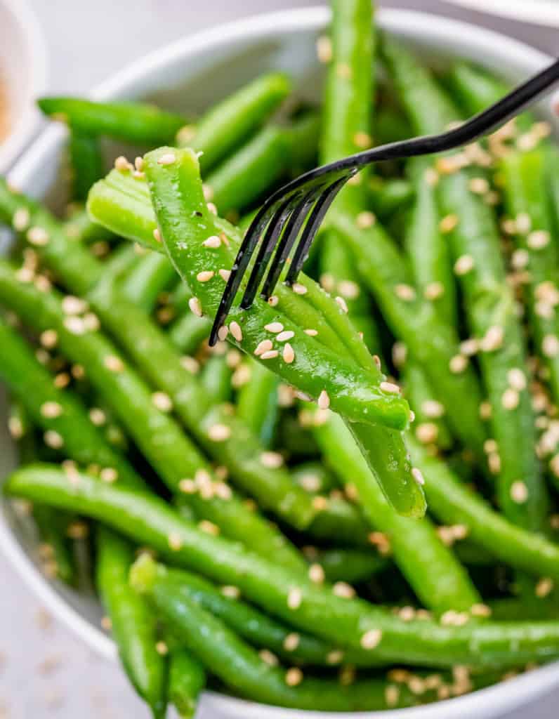 Green beans on a fork.