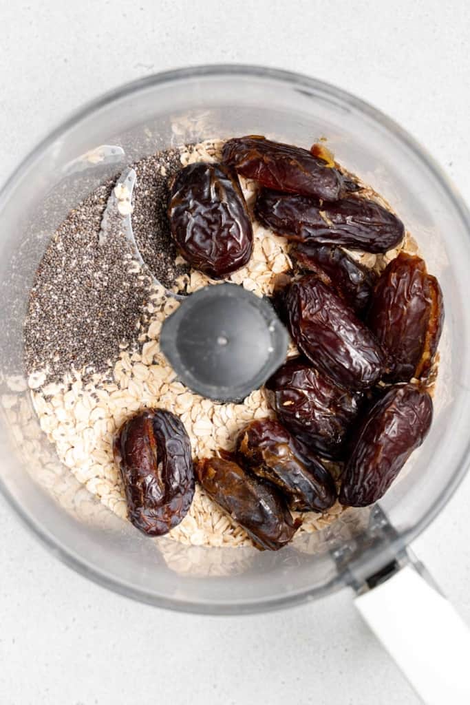 dates, oats, and chia seeds in a food processor
