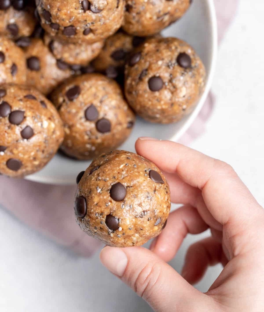 hand holding cookie dough ball