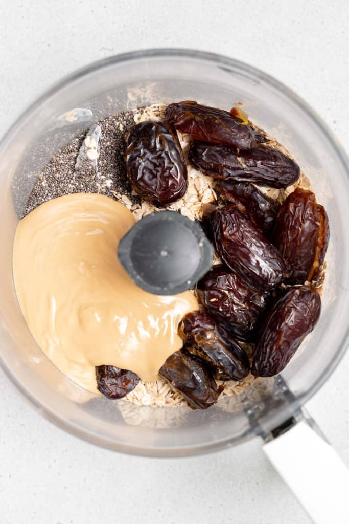 cashew butter added with oats, dates and chia seeds in a food processor
