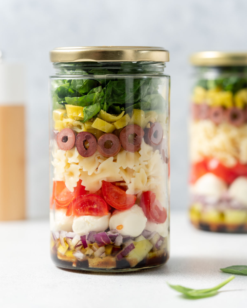 Layered pasta salad in a jar.