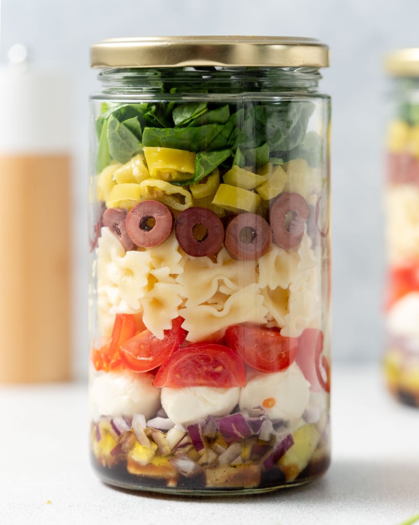 side shot of salad jar with pasta and veggies 
