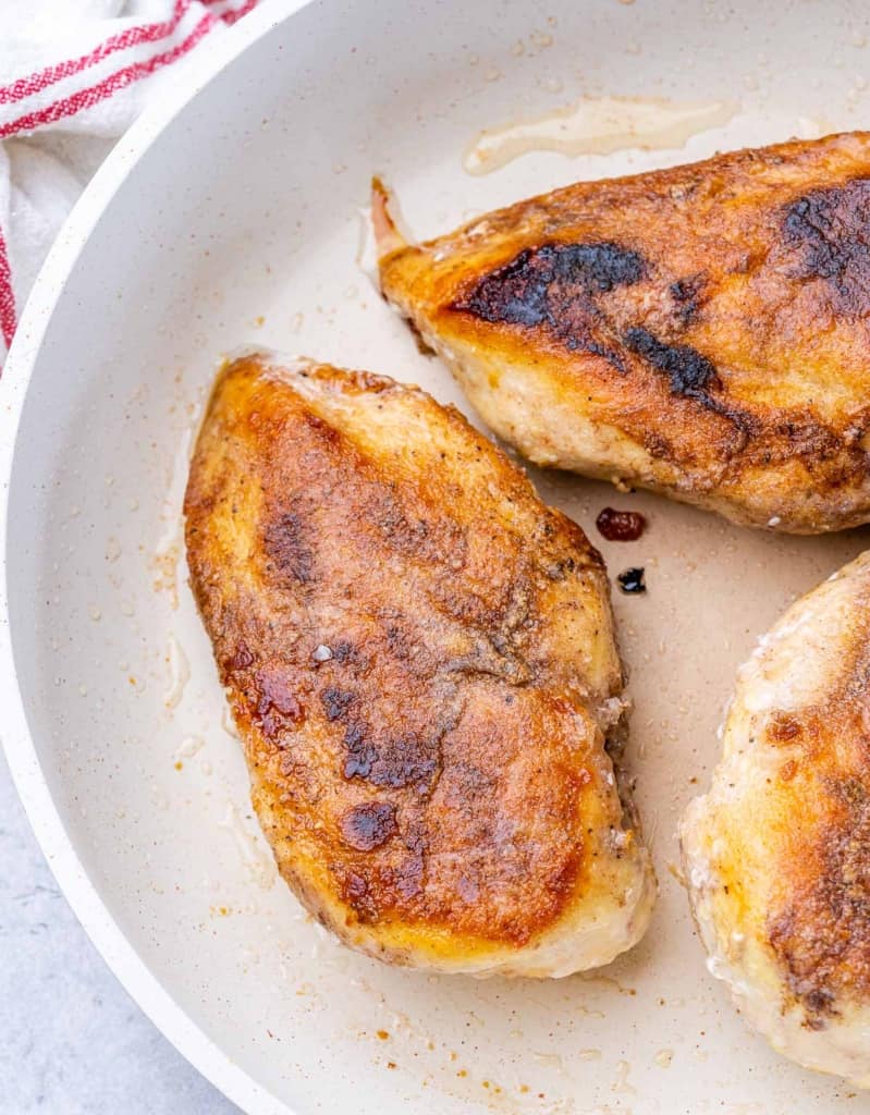 seared chicken breast on a pan