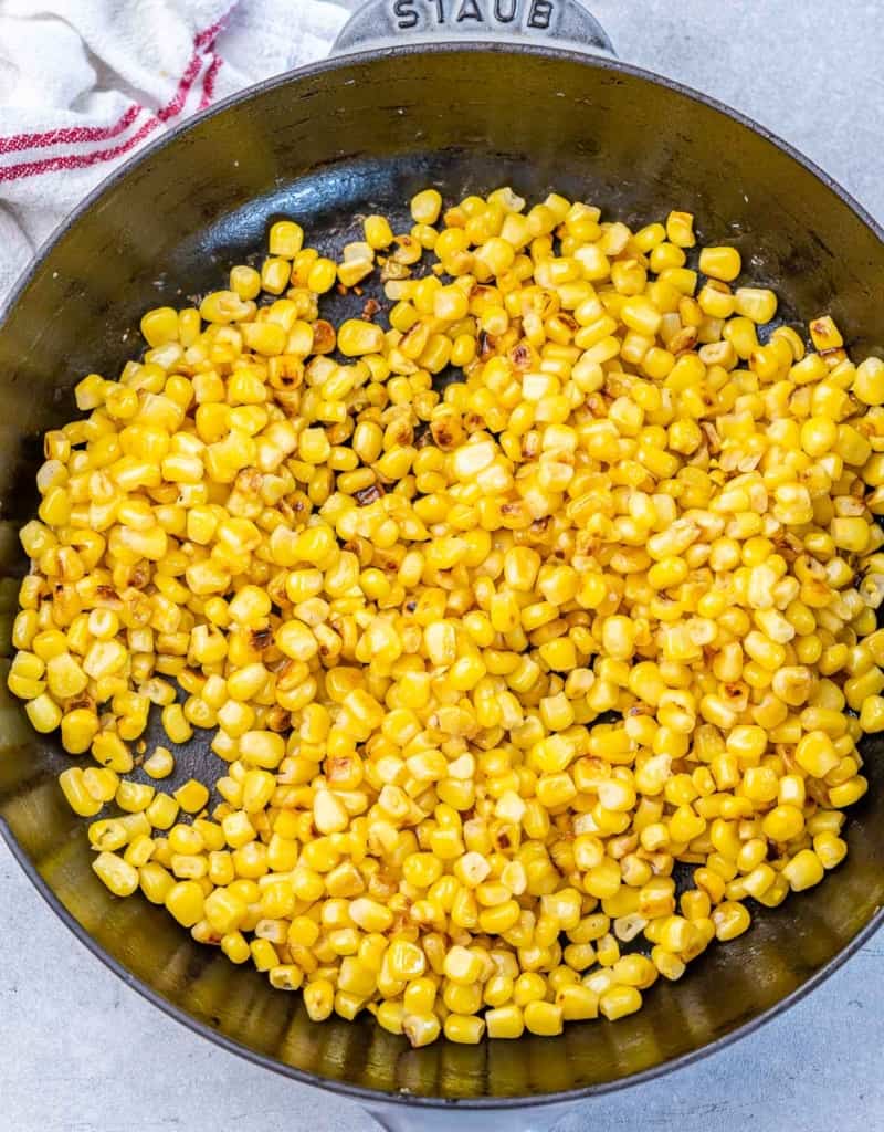 Cooking corn in a skillet.