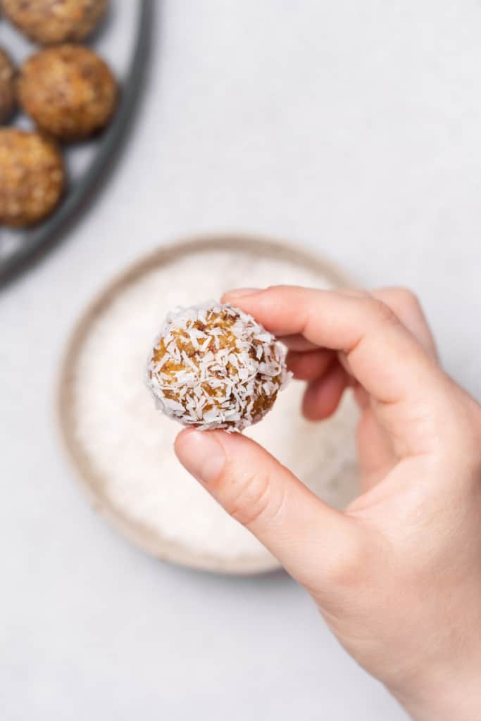 Energy ball rolled in coconut.