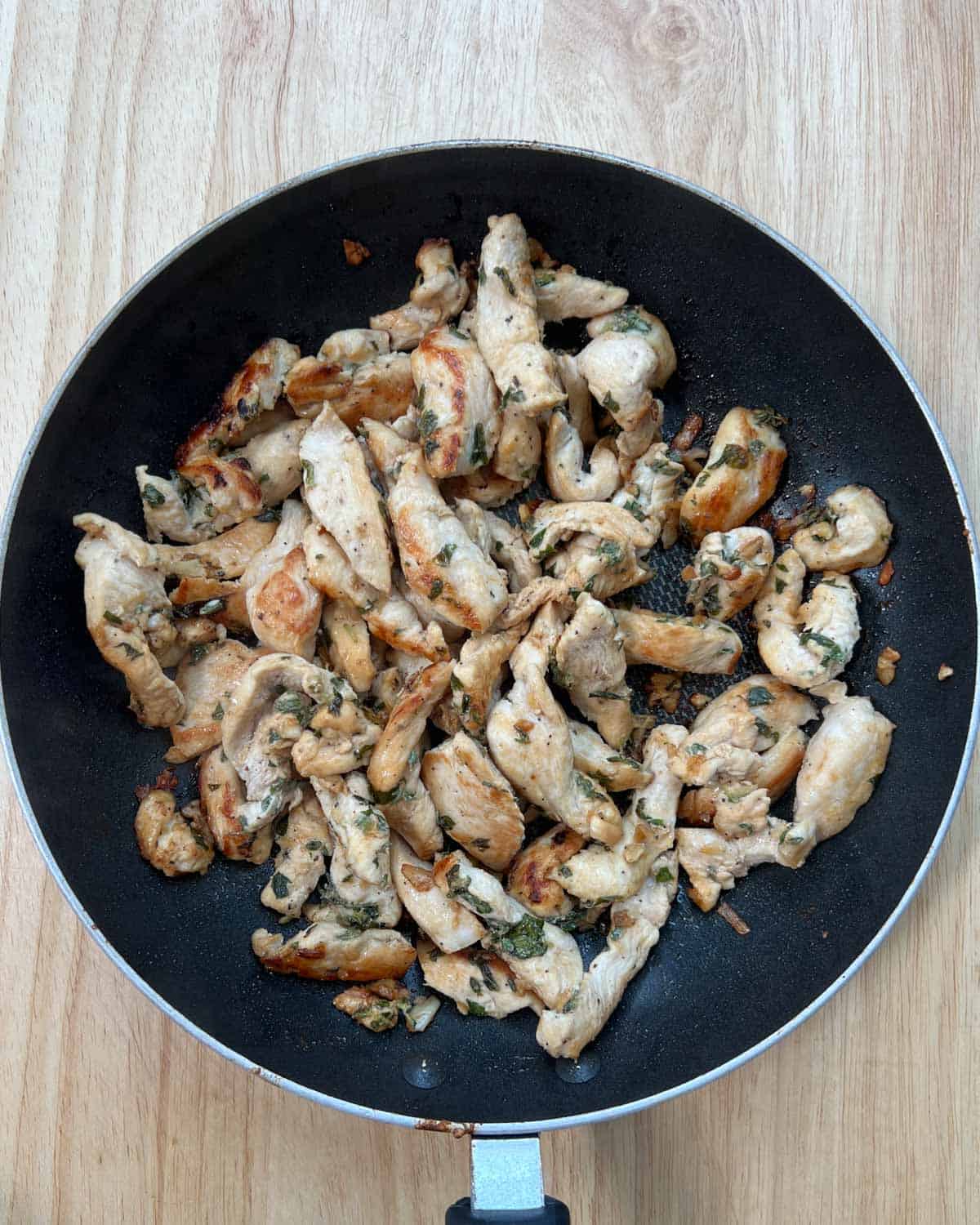 cooked chicken strips in a pan.