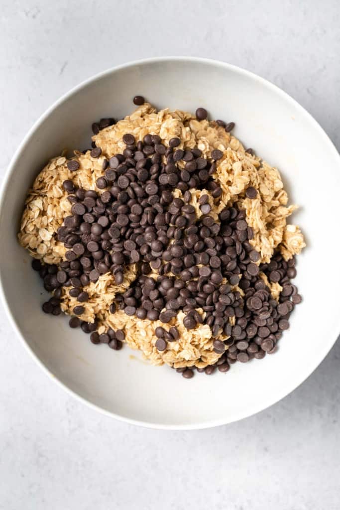 Chocolate chips on top of oat peanut butter mixture.