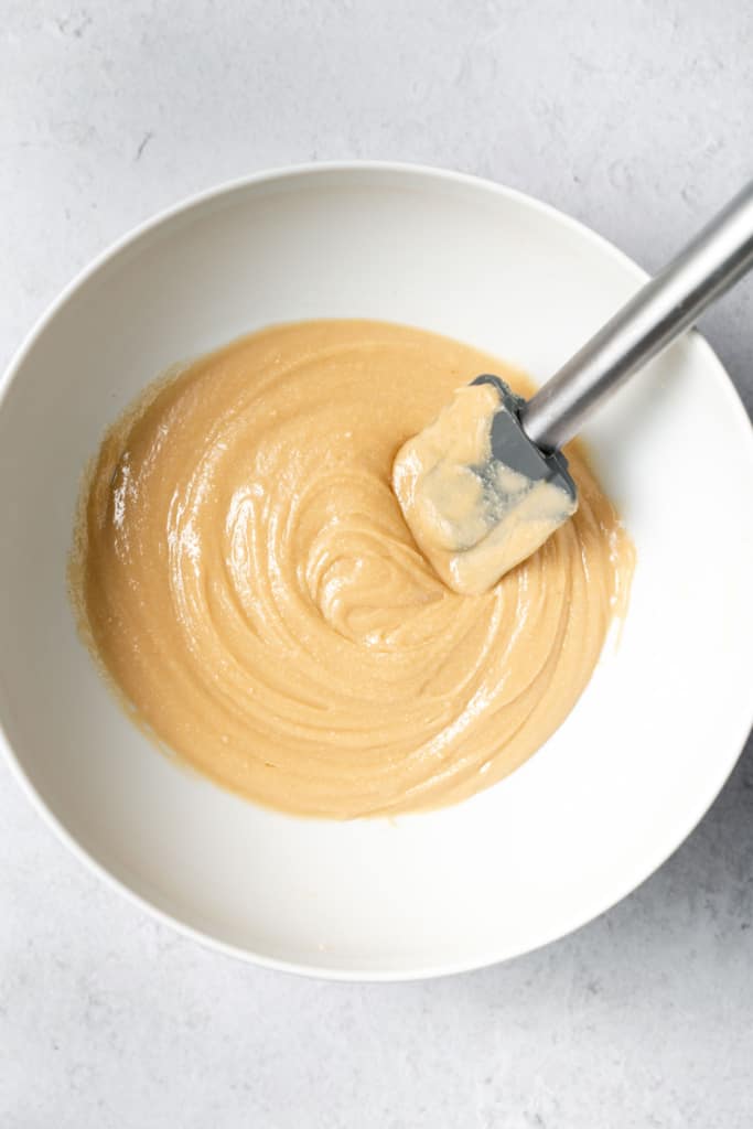 Stirring peanut butter and honey together.
