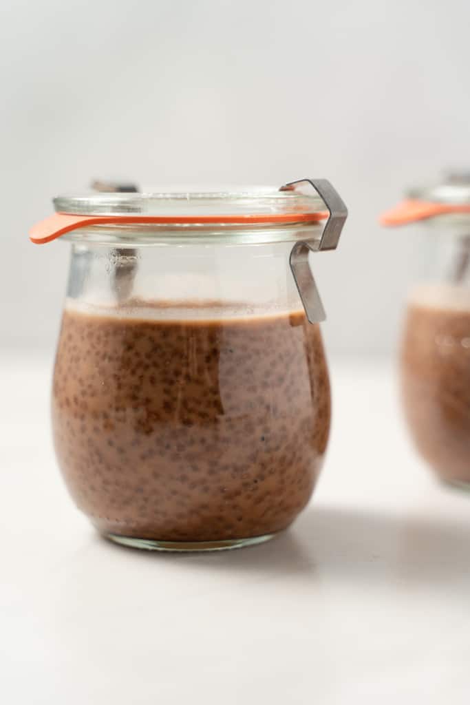 Chia seed pudding in a small glass jar with a lid.