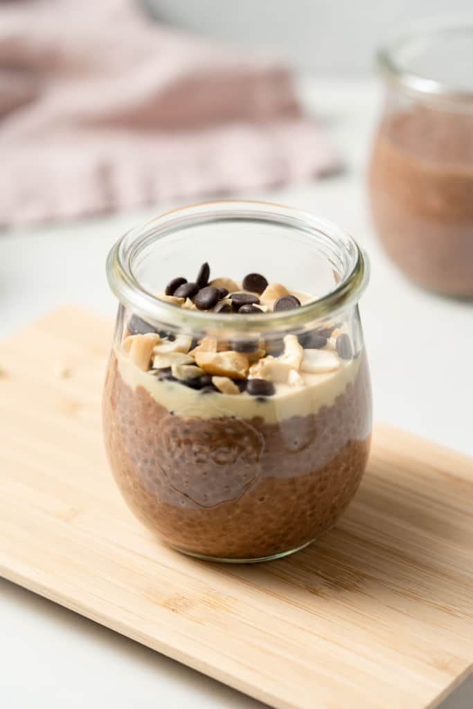 Chia pudding topped with peanut butter, chocolate chips and peanut butter chips.