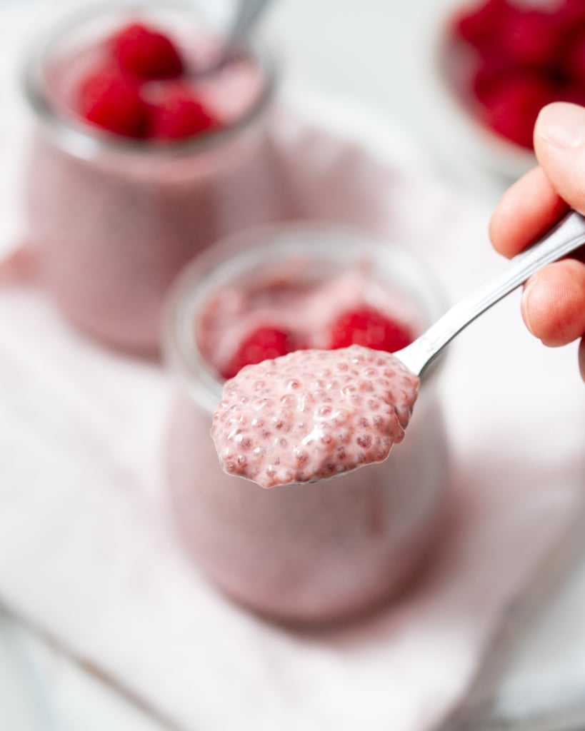 spoonful of chia pudding by the jar of chia pudding
