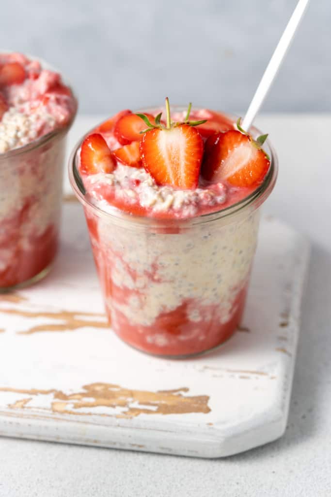 Jars of strawberry and cream protein overnight oats.