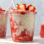 side shot of a jar with overnight oats and blended fresh strawberries